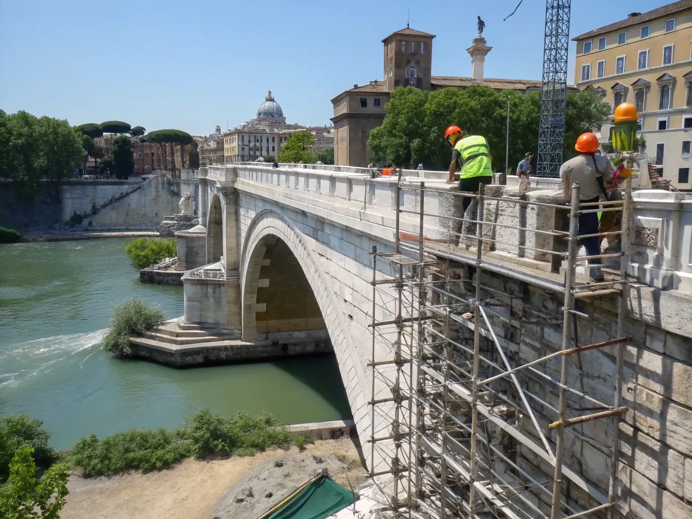 A photograph showcasing the meticulous restoration of a centuries-old stone bridge in Pomayrols, with ASPCP volunteers carefully repairing the structure under the supervision of a professional conservationist. The image highlights the dedication and expertise involved in preserving the commune's historical infrastructure.